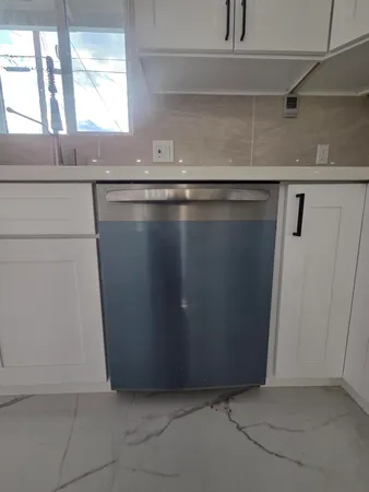 a view of a refrigerator in a kitchen