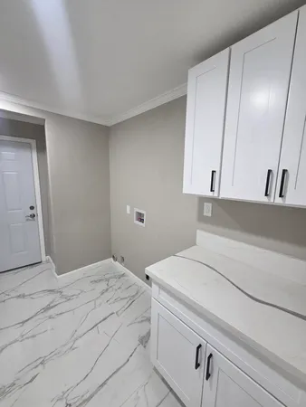 a bedroom with a bed and a cabinets