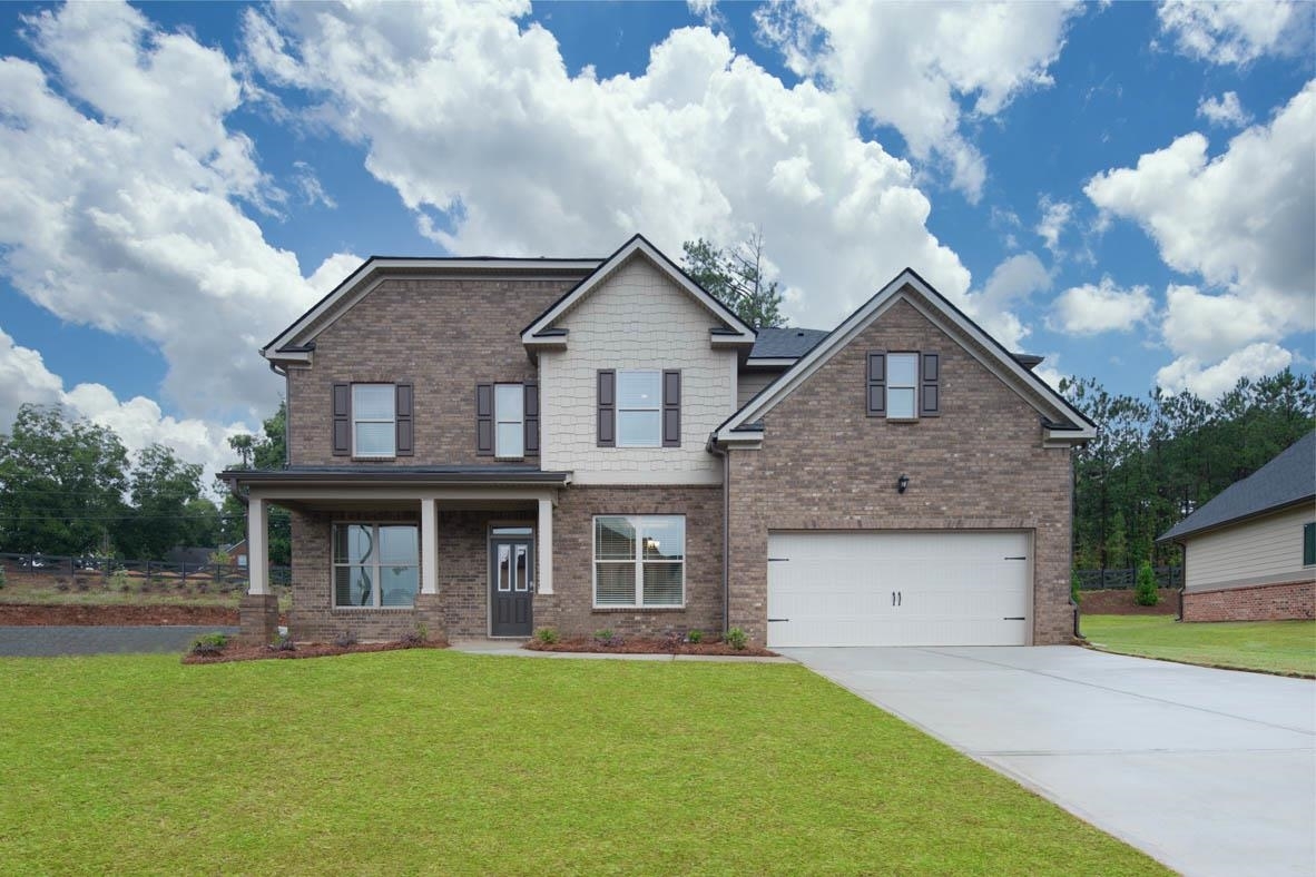 415 Beachview Road, Unit 41 Hampton, GA 30228 - Photo 1 of 1 a front view of a house with garden
