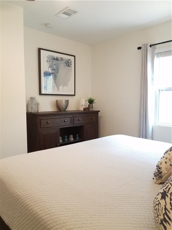5405 Hudson Street Austin, TX 78721 - Photo 28 of 37 Well-lit sleeping quarters with a charming window offering gentle natural illumination.