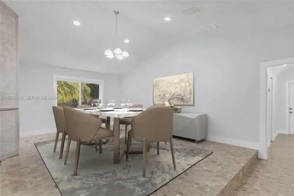 a view of a dining room with furniture and window