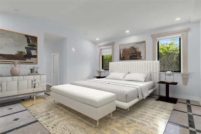 a bedroom with a large bed and a window