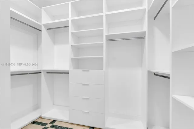 a large spacious bathroom with a tub sink shower and mirror