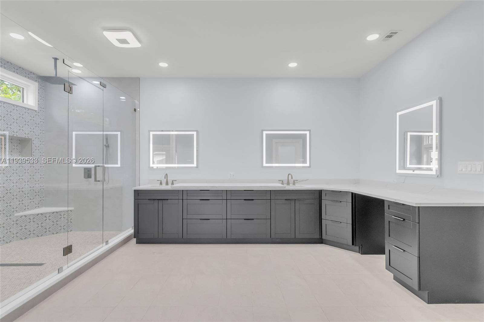 11835 Southwest 47th Street Miami, FL 33175 - Photo 18 of 48 a large spacious bathroom with a tub sink shower and mirror