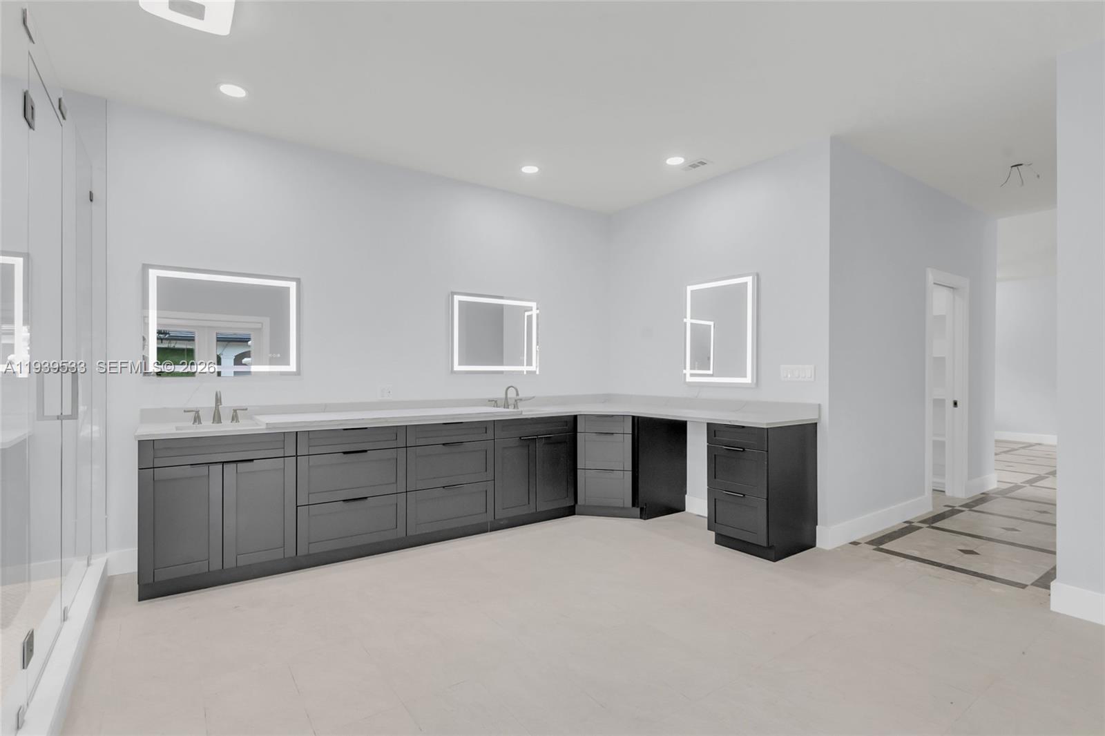 11835 Southwest 47th Street Miami, FL 33175 - Photo 19 of 48 a spacious bathroom with double vanity sink and mirror
