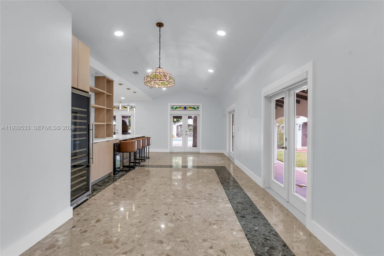 11835 Southwest 47th Street Miami, FL 33175 - Photo 28 of 48 a view of an empty room with a fireplace and a window