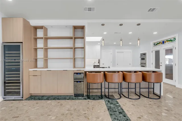 a view of a porch with a table and chairs