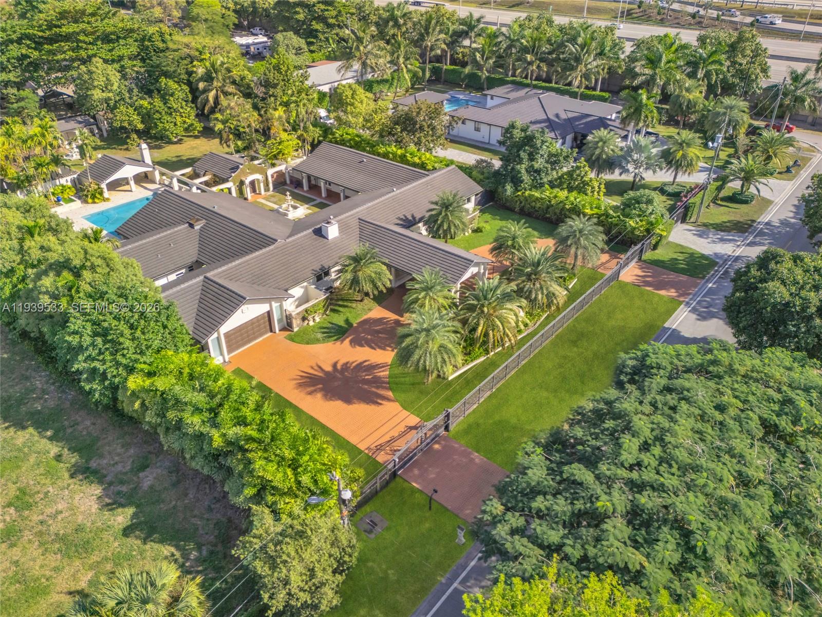 11835 Southwest 47th Street Miami, FL 33175 - Photo 3 of 48 an aerial view of a house with a garden