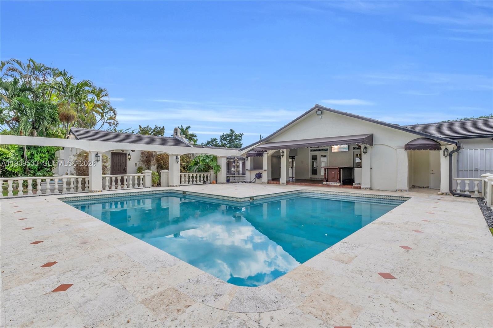 11835 Southwest 47th Street Miami, FL 33175 - Photo 34 of 48 front view of a house with swimming pool