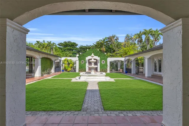 a front view of a house with a yard and porch