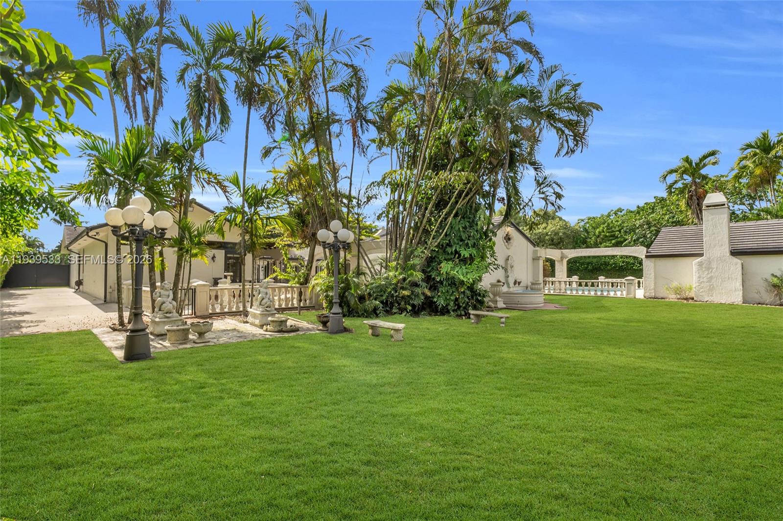 11835 Southwest 47th Street Miami, FL 33175 - Photo 44 of 48 a garden with trees in front of it