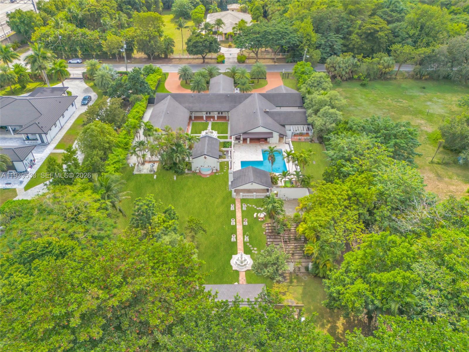 11835 Southwest 47th Street Miami, FL 33175 - Photo 5 of 48 a aerial view of a house with a garden and lake view