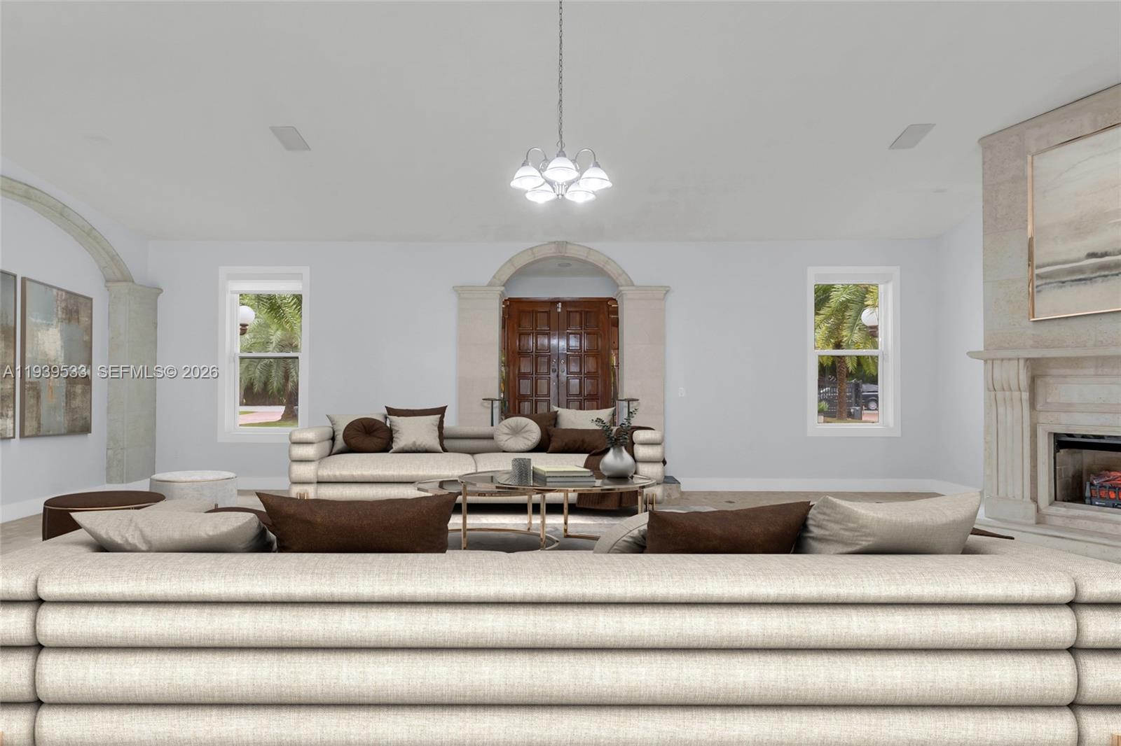 11835 Southwest 47th Street Miami, FL 33175 - Photo 9 of 48 a living room with furniture chandelier and a fireplace