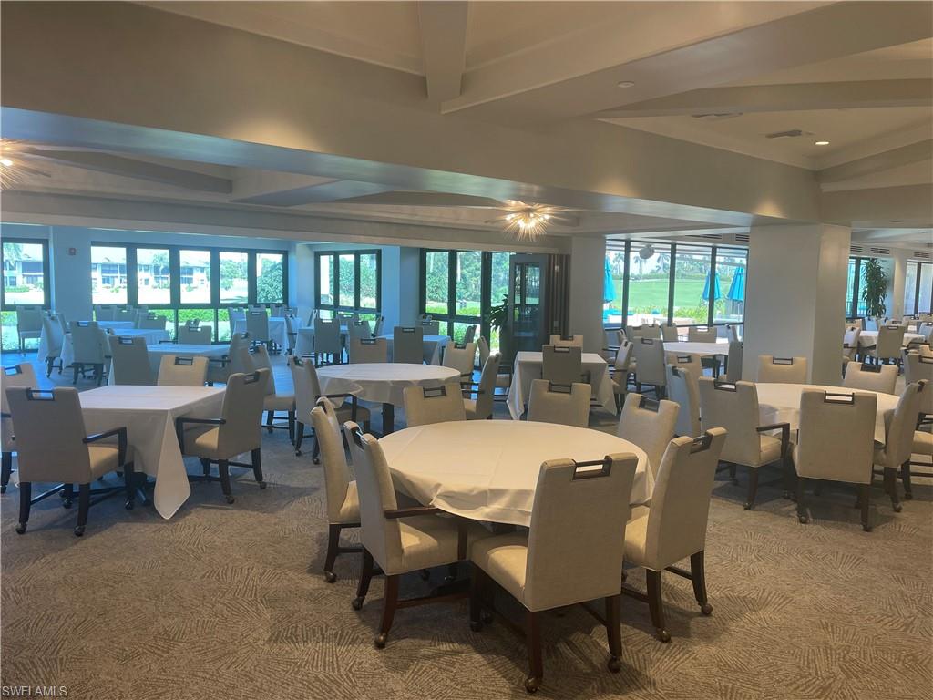 241 St James Way Naples, FL 34104 - Photo 33 of 34 Carpeted dining room featuring healthy amount of natural light and beam ceiling