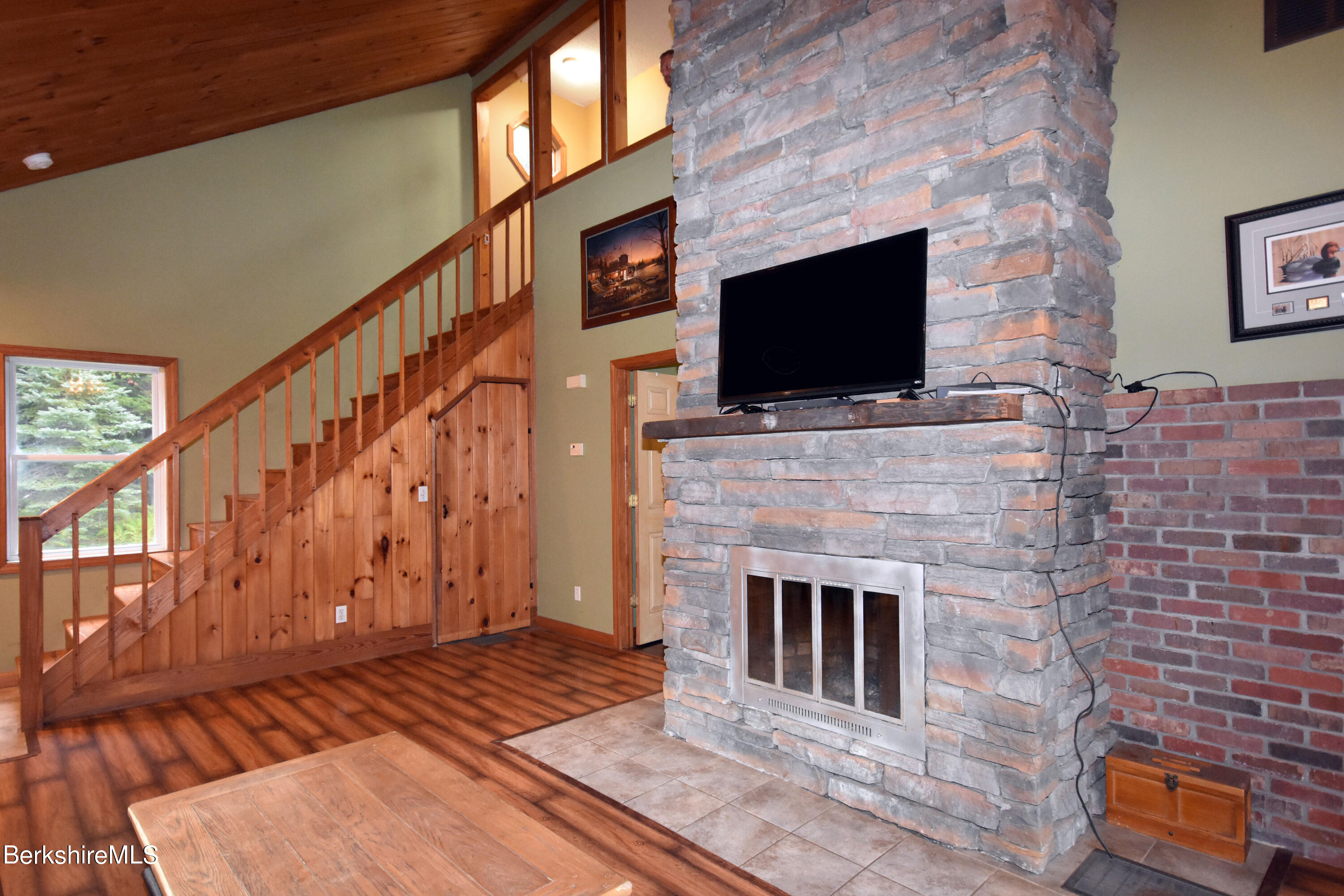 206 Sam Hill Road Worthington, MA 01098 - Photo 8 of 40 a living room with fireplace furniture and a flat screen tv