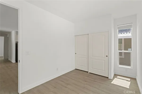 an empty room with wooden floor