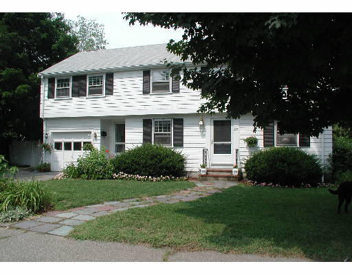 28 Willow Road Wellesley, MA 02482 - Photo 1 of 1 a front view of a house with a garden