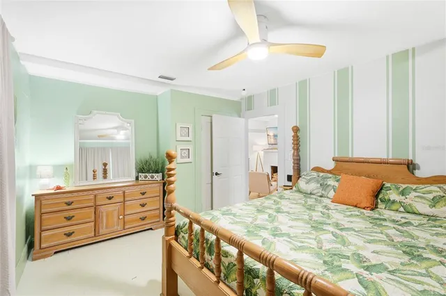 a bedroom with a bed and a dresser