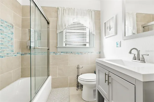 a bathroom with a sink a toilet and a bathtub