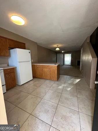 a living room with a couch and a stove top oven