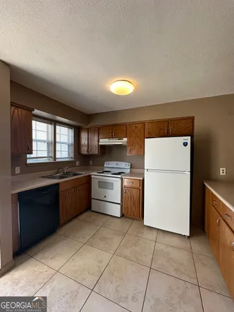 a kitchen with a cabinets and appliances
