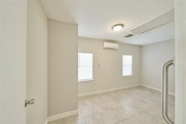 a view of an empty room with a window