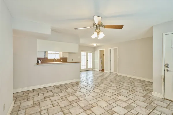 a view of a kitchen with a sink and cabinets
