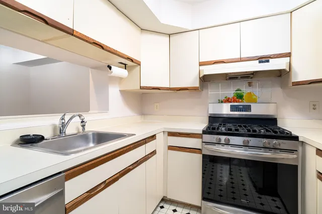 a kitchen with a stove and a sink