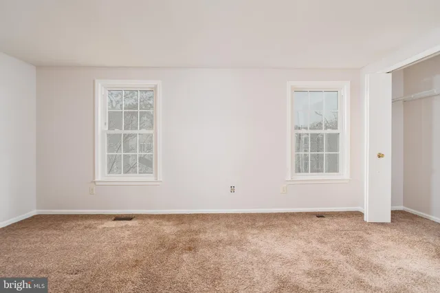 an empty room with windows