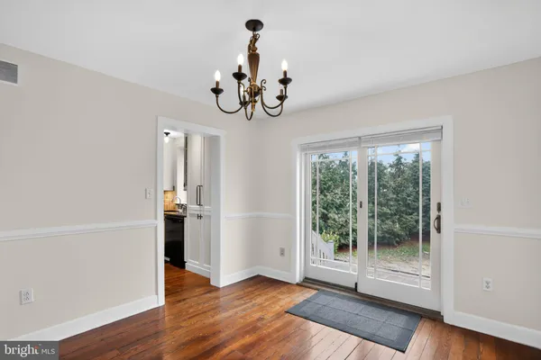 a kitchen with a refrigerator sink and cabinets