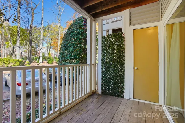 a view of a porch with wooden floor