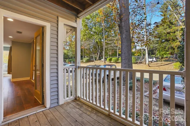 a view of a porch with wooden floor