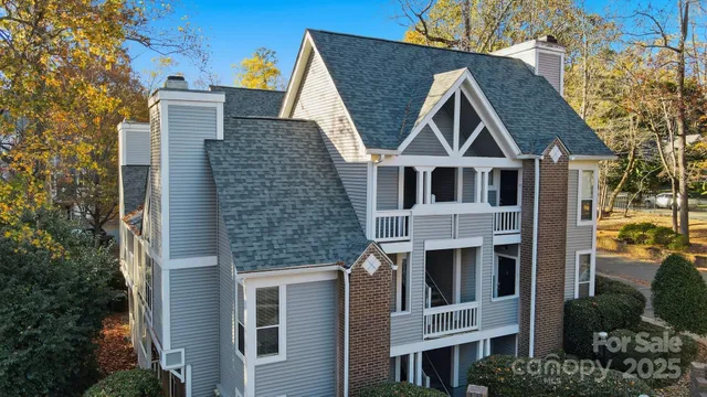 a aerial view of a house with a yard