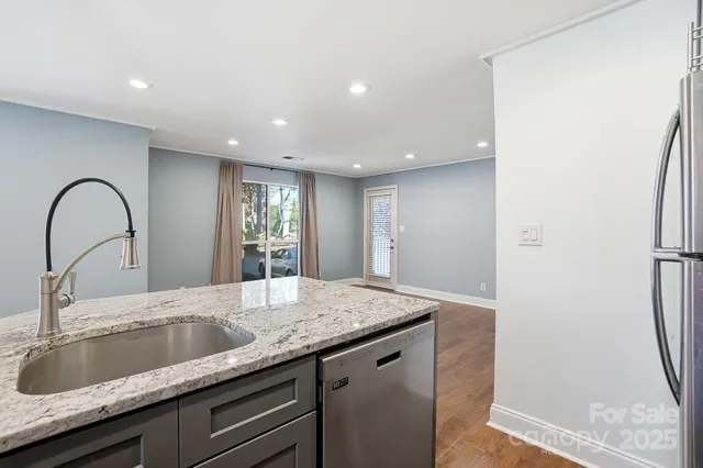 a kitchen with a sink and a refrigerator