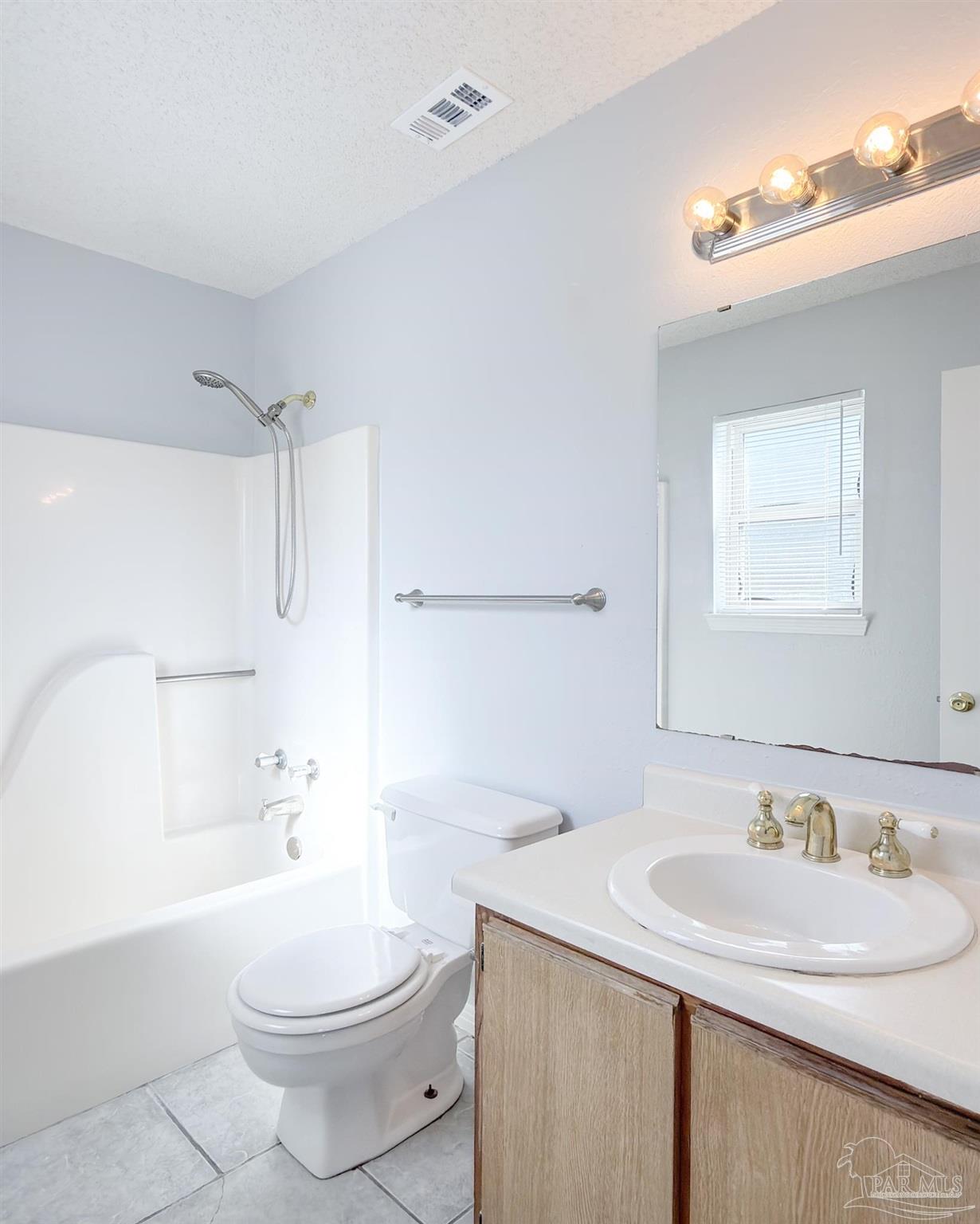 1341 Dog Track Road Pensacola, FL 32506 - Photo 13 of 26 a bathroom with a sink a toilet and shower