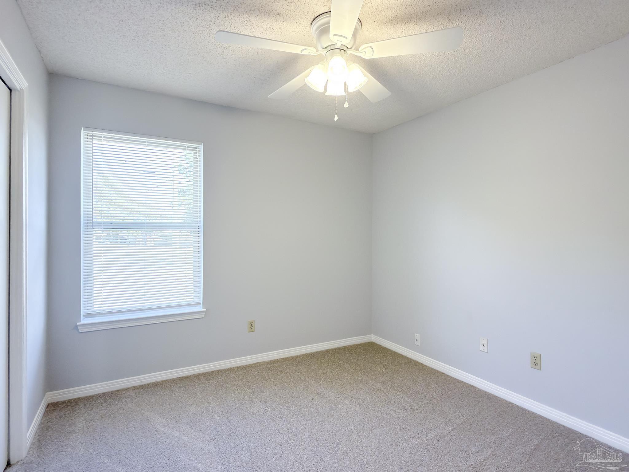 1341 Dog Track Road Pensacola, FL 32506 - Photo 14 of 26 an empty room with a window