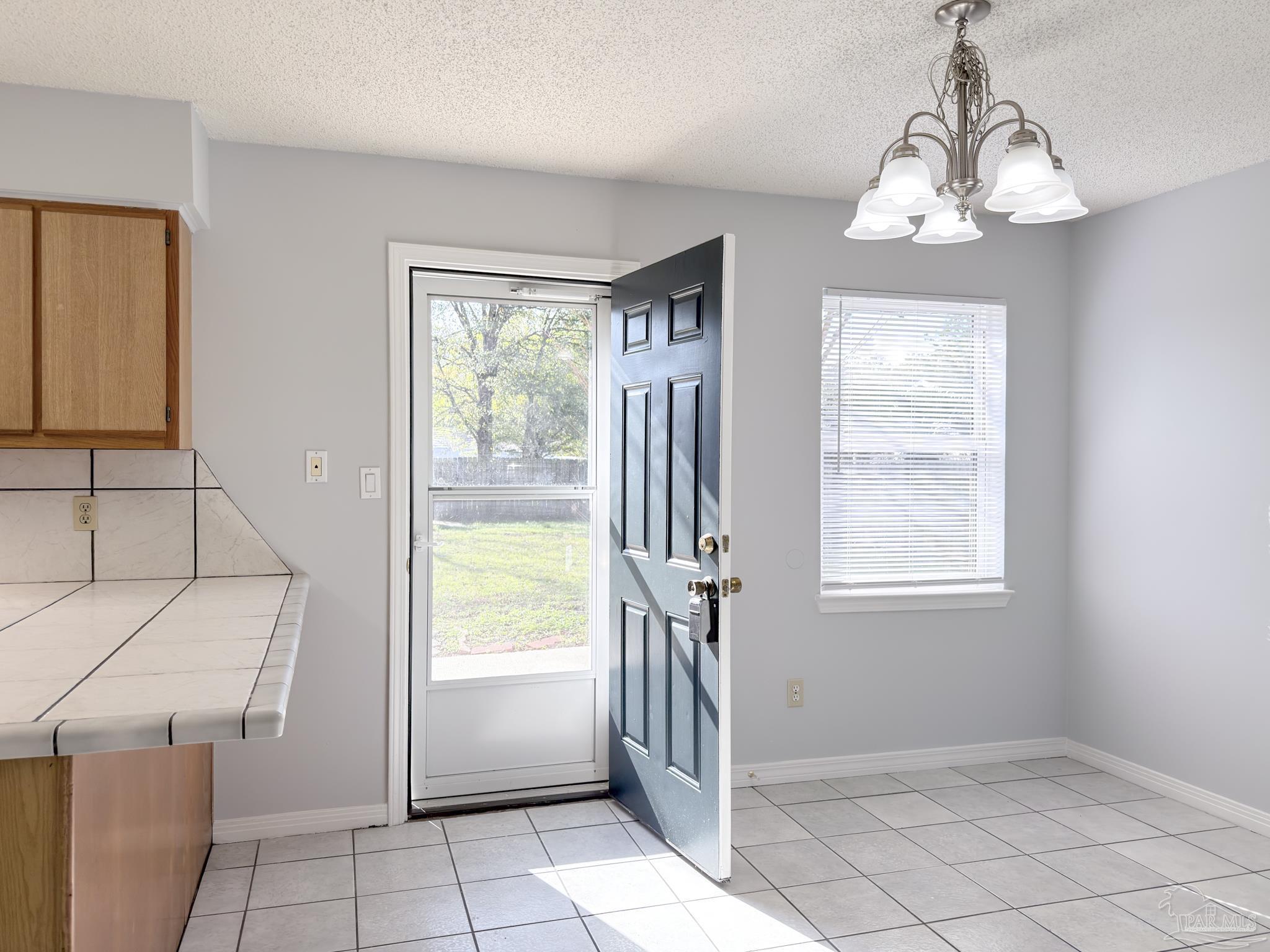 1341 Dog Track Road Pensacola, FL 32506 - Photo 17 of 26 a view of an empty room with a window