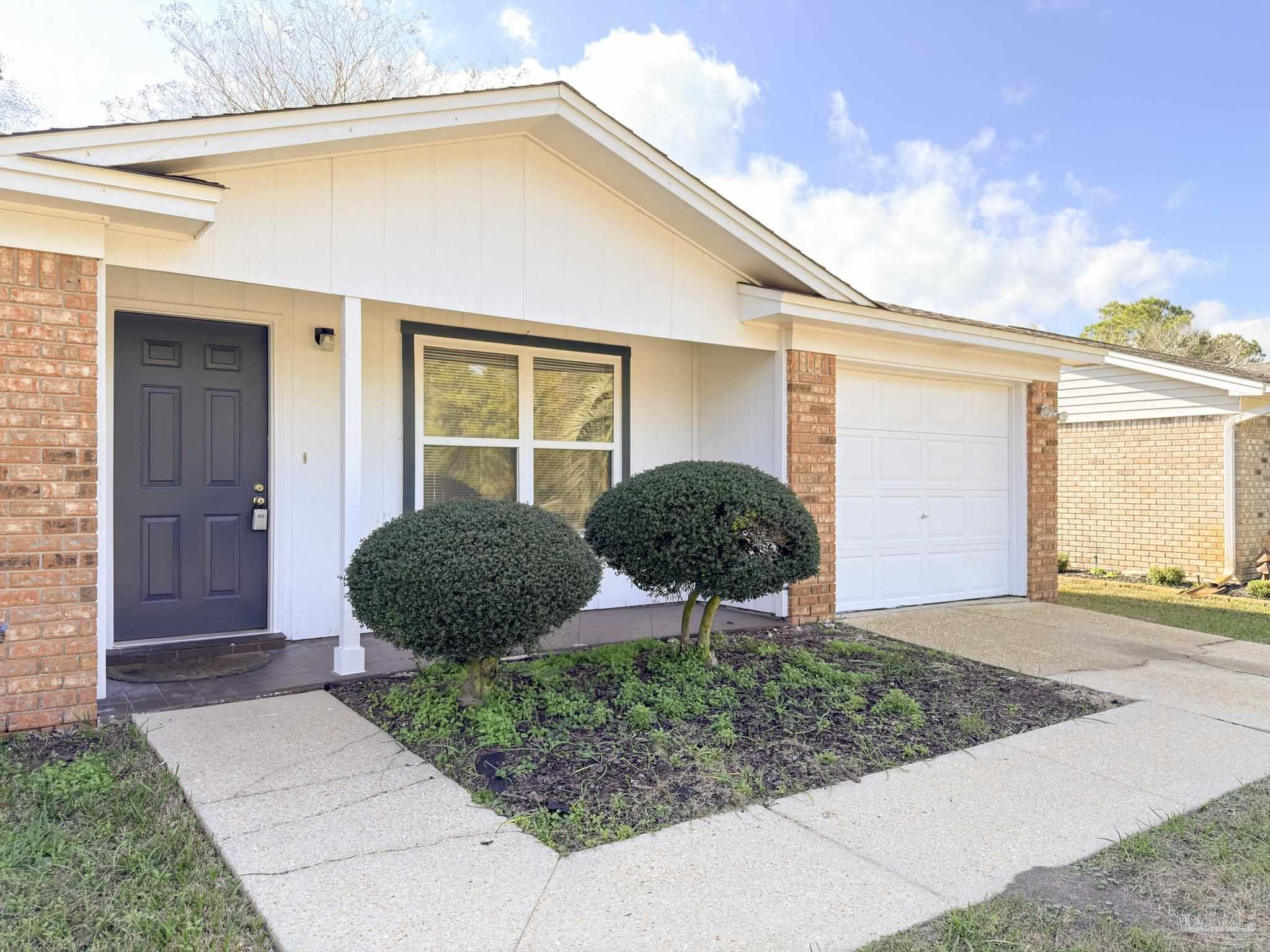 1341 Dog Track Road Pensacola, FL 32506 - Photo 2 of 26 a view of a house with backyard and garden
