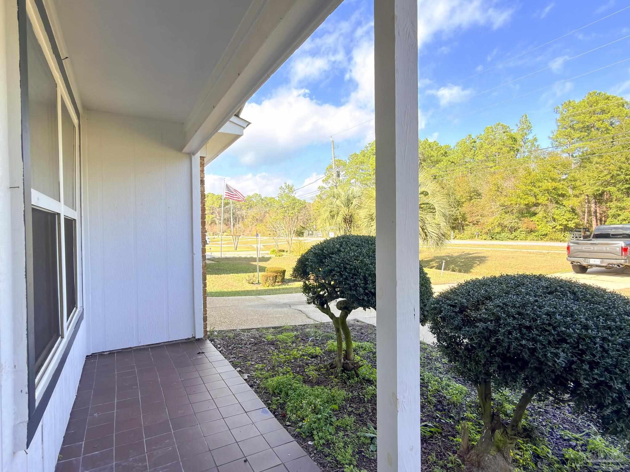 1341 Dog Track Road Pensacola, FL 32506 - Photo 23 of 26 a view of a floor to ceiling window and wooden fence