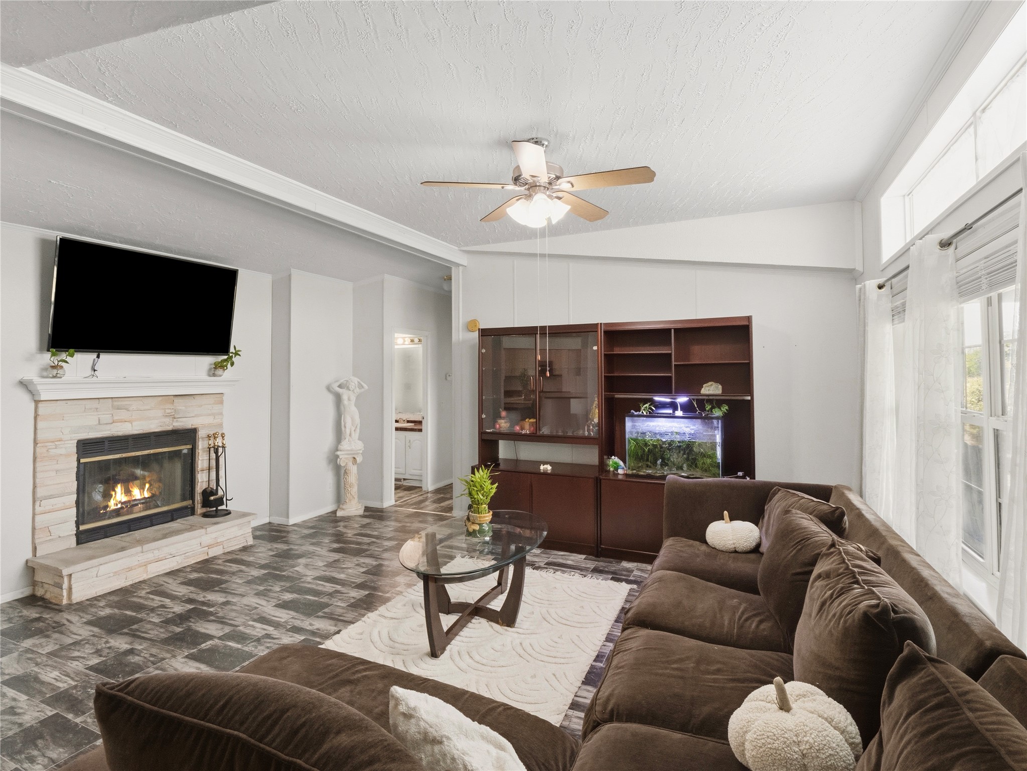 13241 2338th Road Georgetown, TX 78633 - Photo 6 of 26 A comforting fireplace provides warmth and ambiance to this inviting living space.