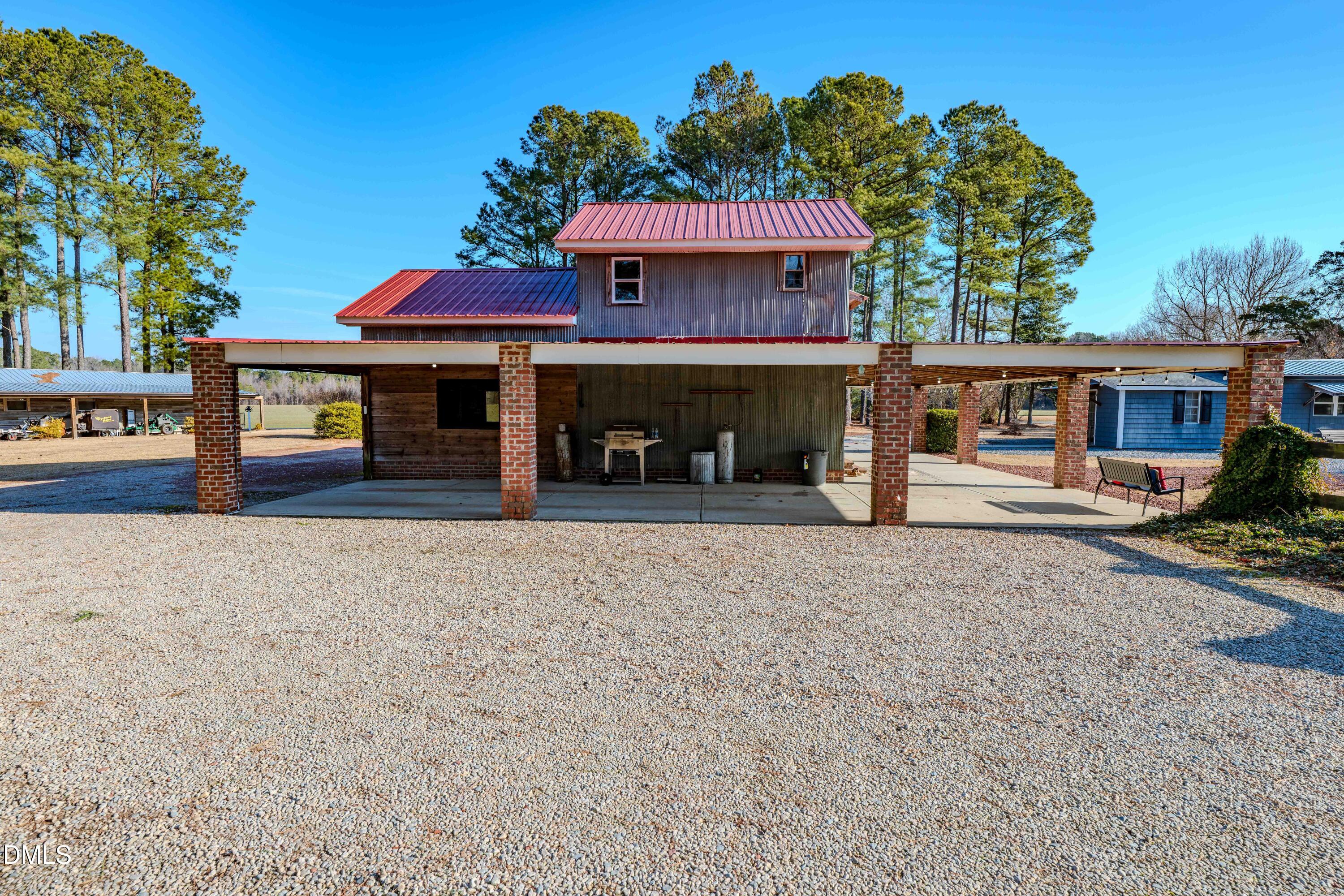 613 Will Lucas Road Linden, NC 28356 - Photo 24 of 98 a front view of a house with a yard and a garage