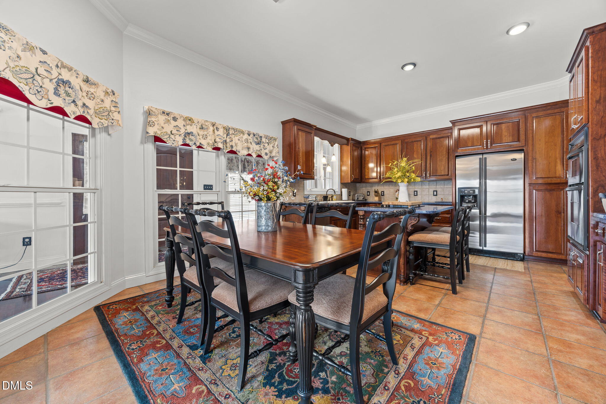 613 Will Lucas Road Linden, NC 28356 - Photo 48 of 98 a dining hall with stainless steel appliances a dining table and chairs with wooden floor