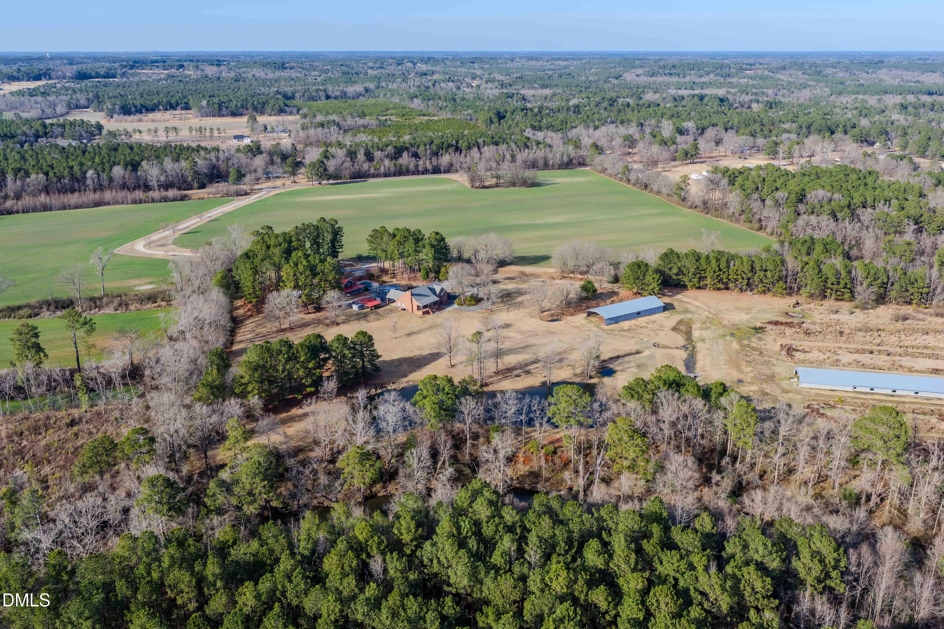 613 Will Lucas Road Linden, NC 28356 - Photo 5 of 98 an aerial view of a residential houses with outdoor space and trees all around