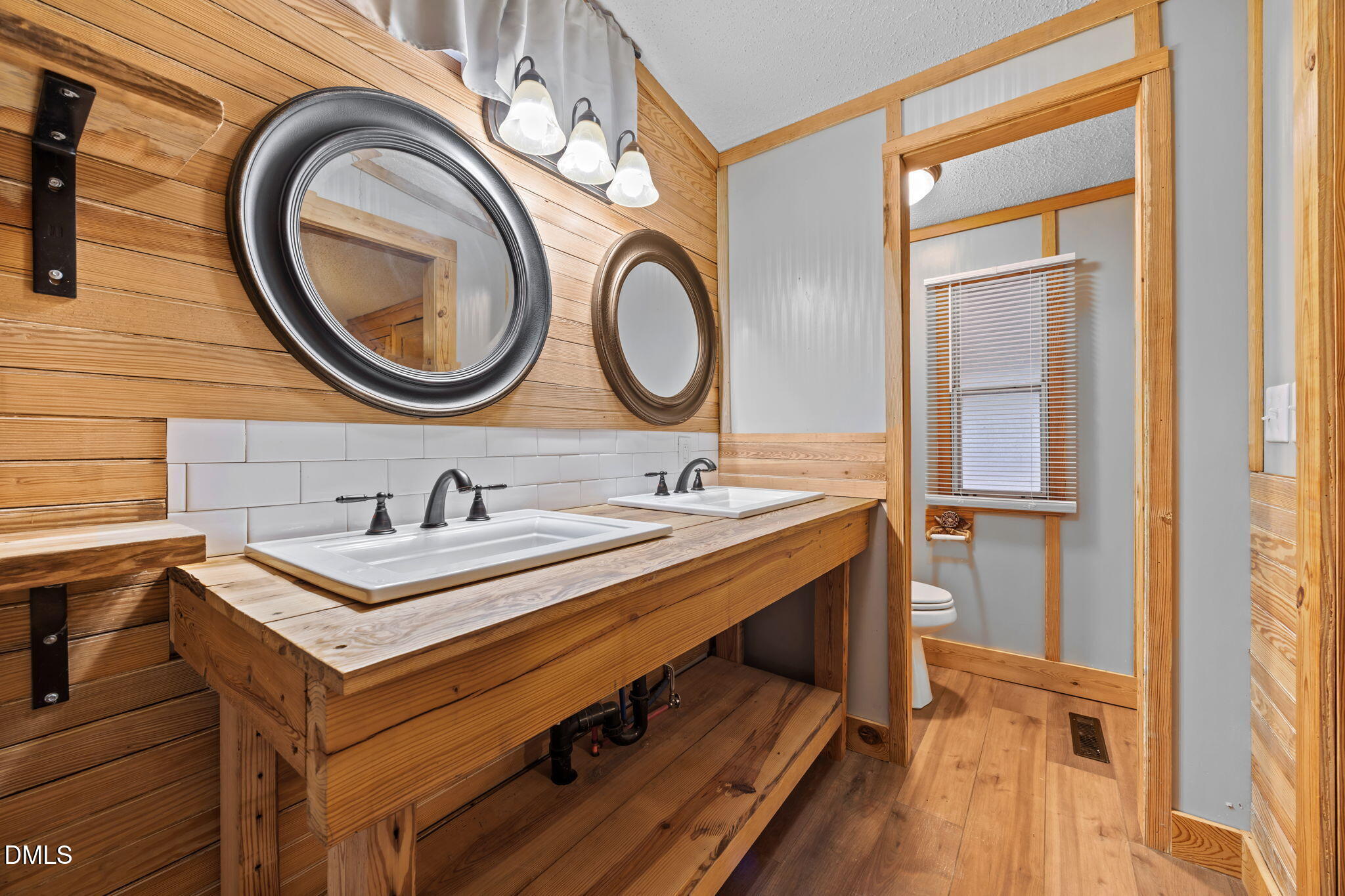 613 Will Lucas Road Linden, NC 28356 - Photo 73 of 98 a bathroom with a sink a mirror and a toilet