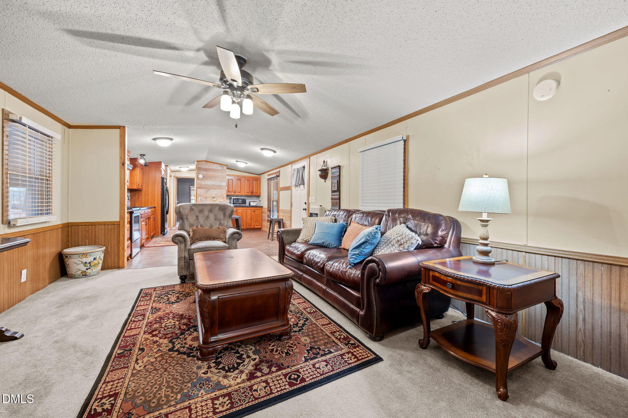 613 Will Lucas Road Linden, NC 28356 - Photo 74 of 98 a living room with furniture a rug and a chandelier