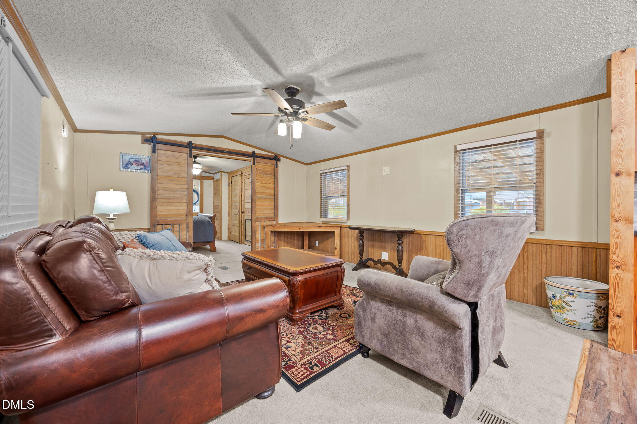 613 Will Lucas Road Linden, NC 28356 - Photo 75 of 98 a living room with furniture a ceiling fan and a window