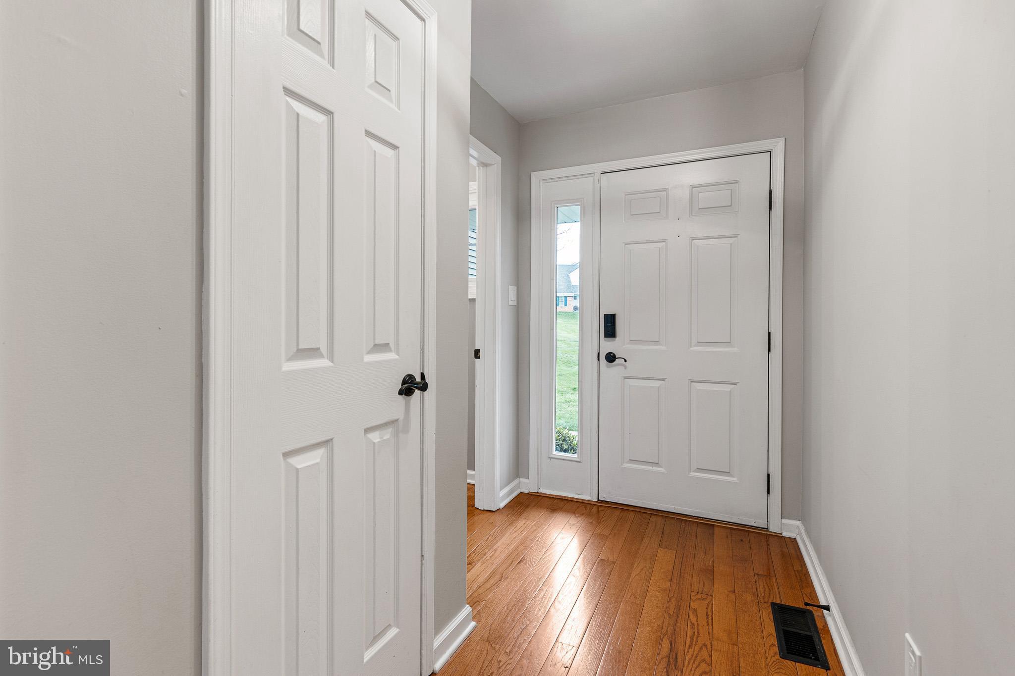 719 Jacques Circle Chester Springs, PA 19425 - Photo 12 of 31 a view of a hallway with wooden floor