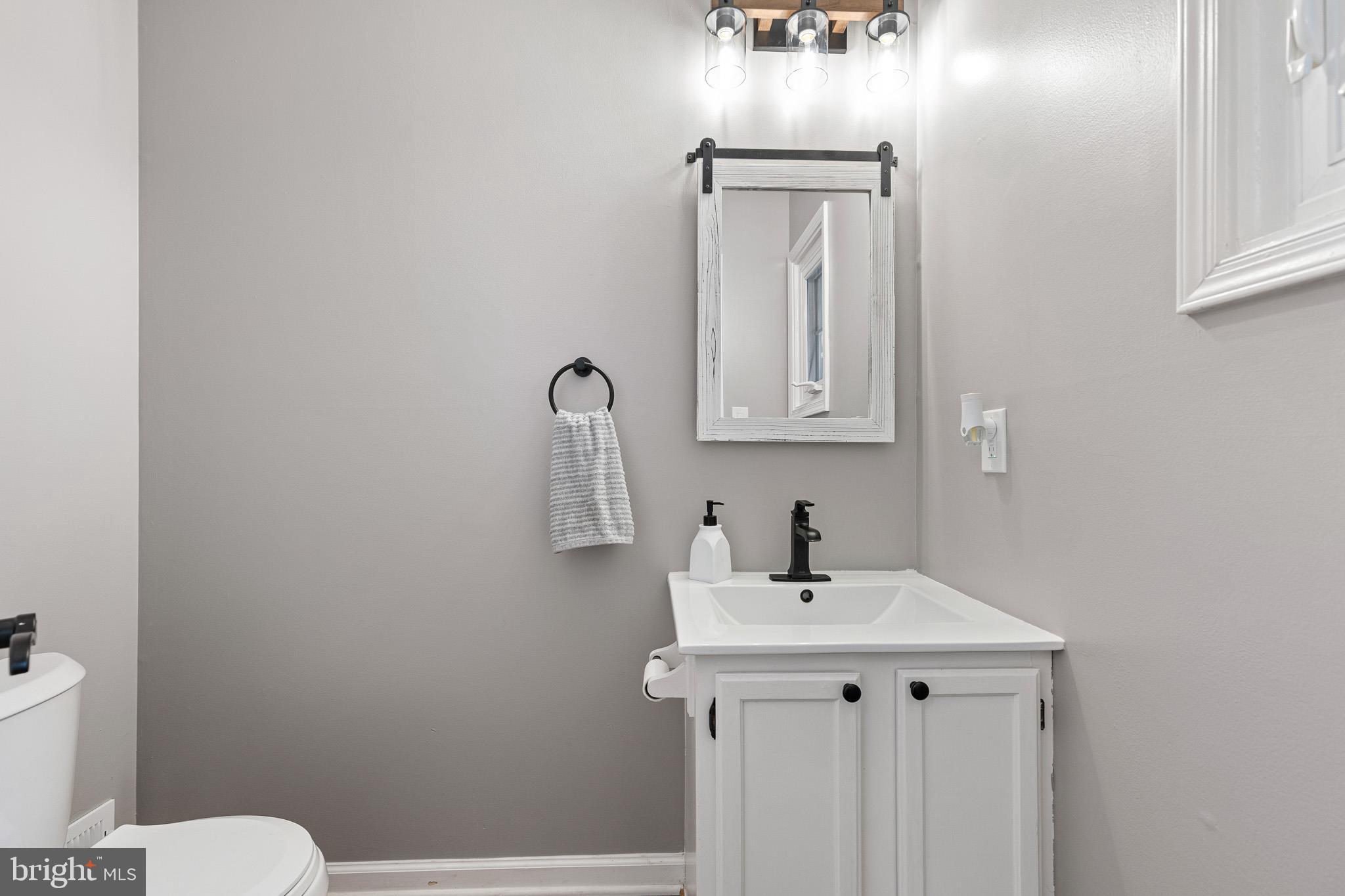 719 Jacques Circle Chester Springs, PA 19425 - Photo 14 of 31 a bathroom with a sink vanity mirror and toilet
