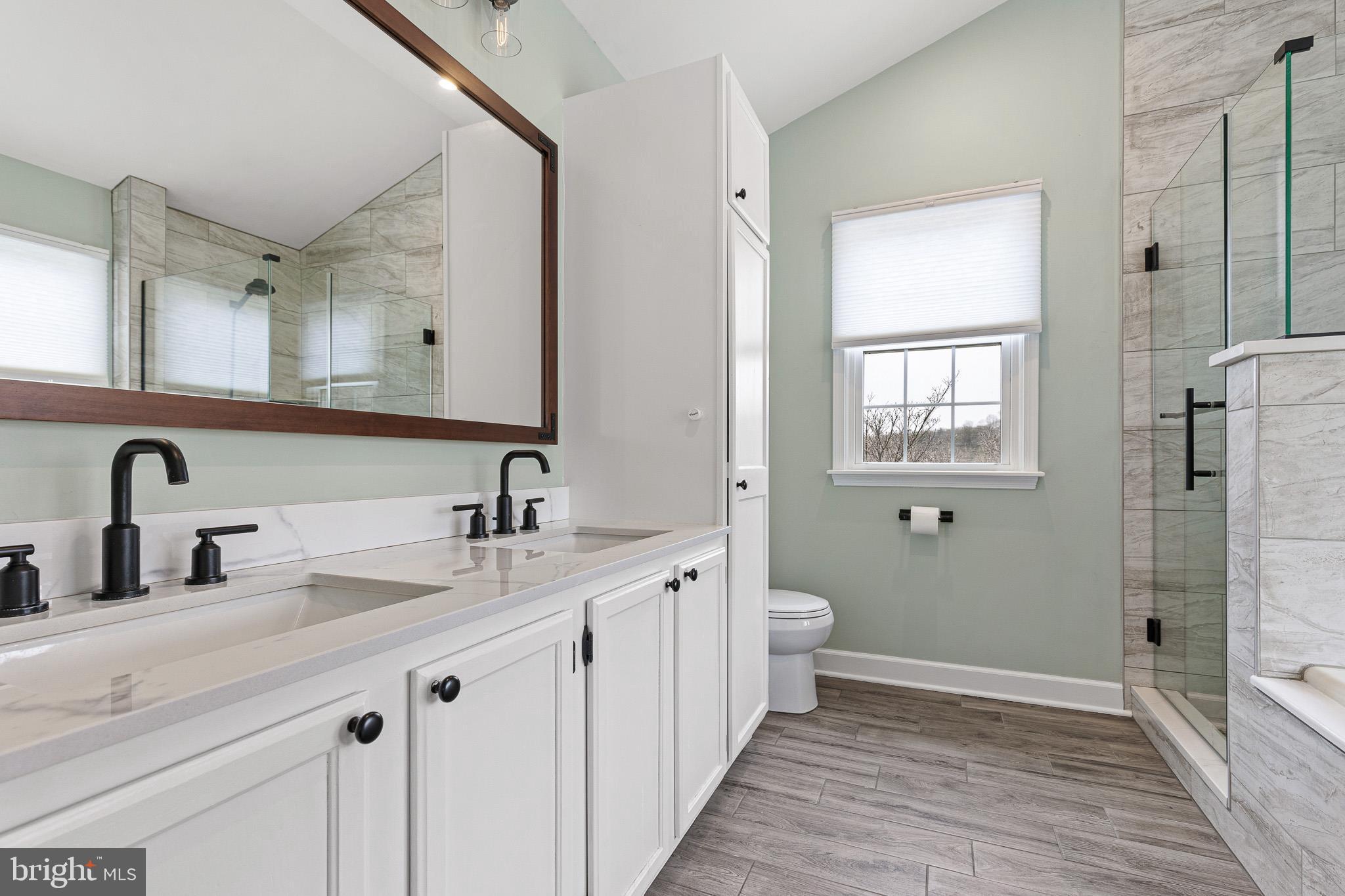 719 Jacques Circle Chester Springs, PA 19425 - Photo 19 of 31 a bathroom with a double vanity sink and mirror