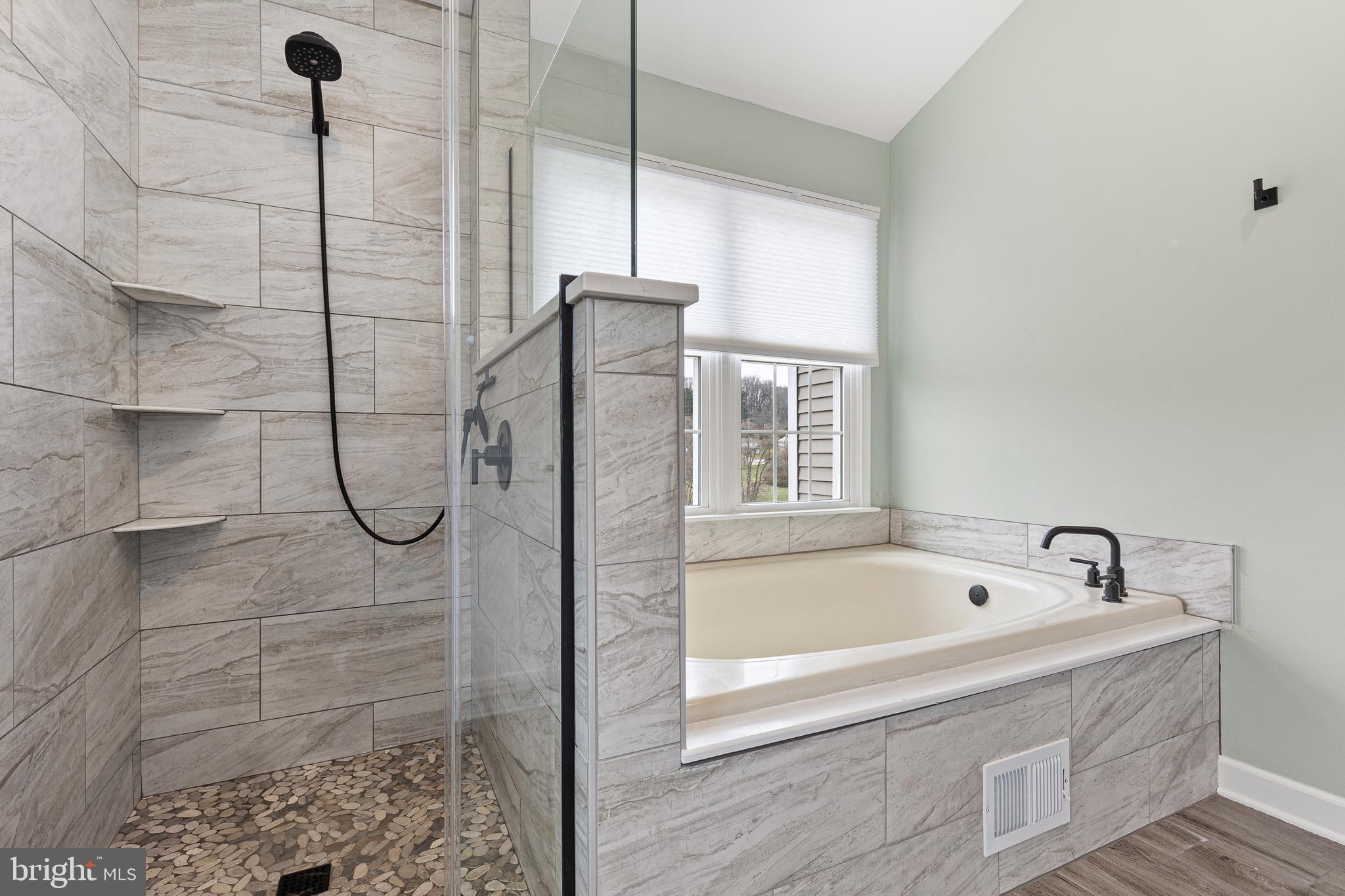 719 Jacques Circle Chester Springs, PA 19425 - Photo 20 of 31 a bathroom with a bathtub and a shower